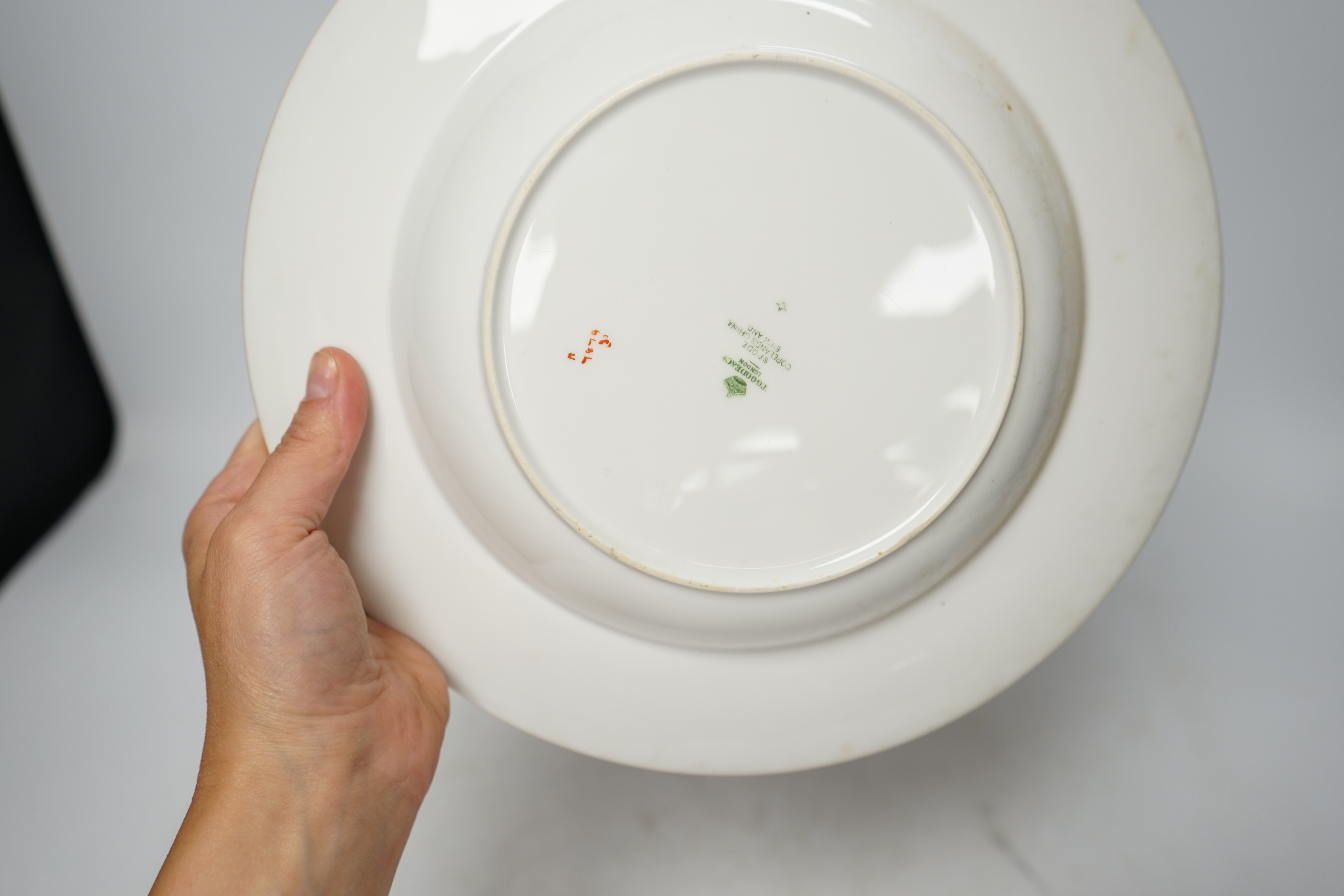 Spode Copeland dinner ware, comprising an oval and a rectangular meat dish and six plates, each painted with peonies and other flowers, largest 43cm wide (8). Condition - poor